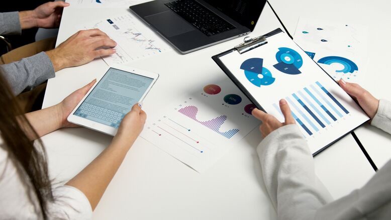 Illustration of a CRM dashboard with data validation checkmarks and quality improvement icons.